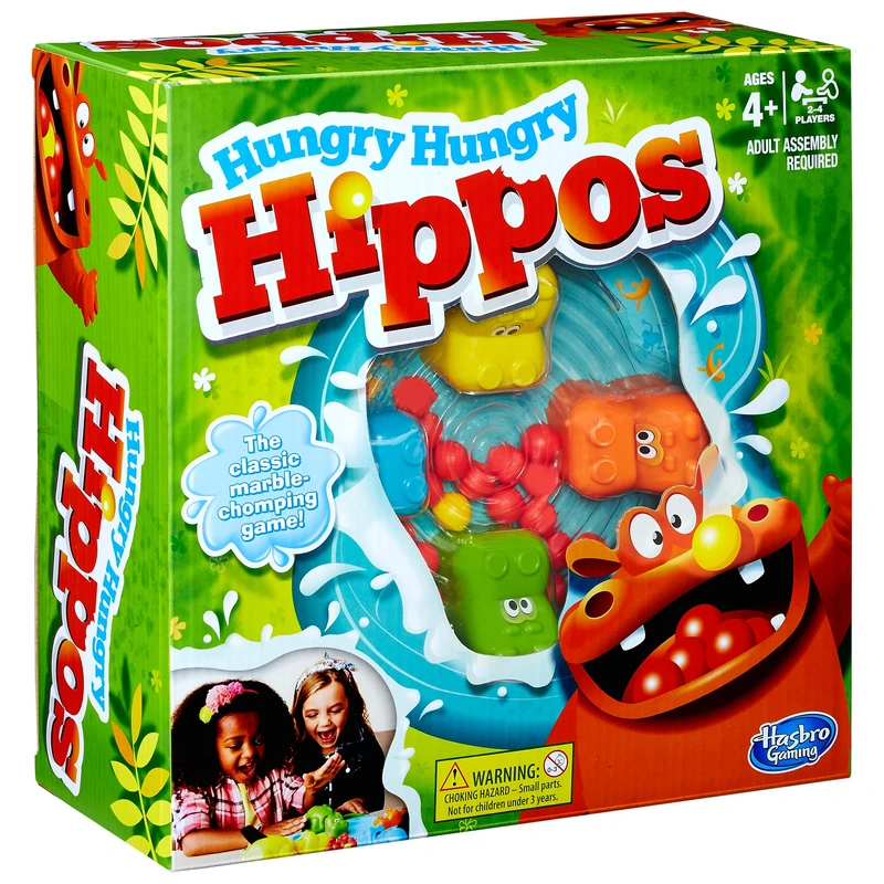 Children playing Hungry Hungry Hippos game UK