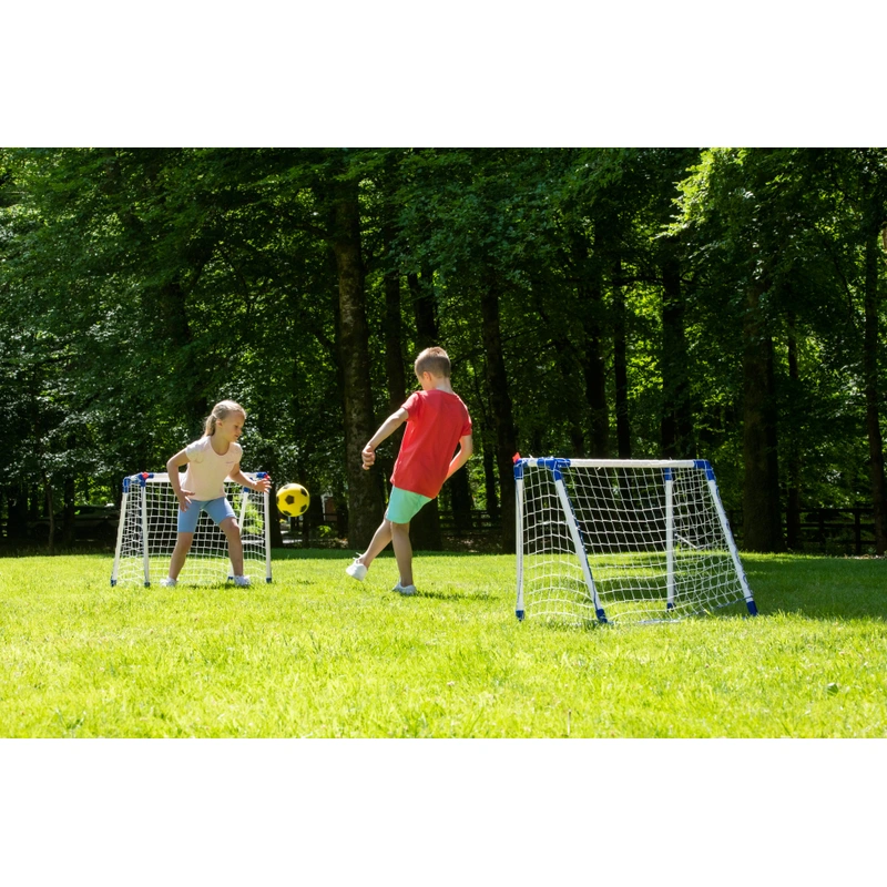 Kids playing football with portable goal set UK