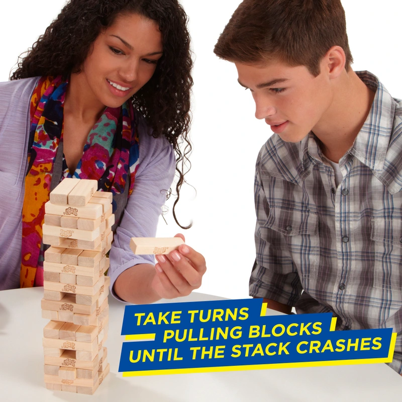 Hand removing block from Jenga tower