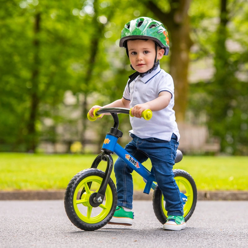 Dinosaur themed kids balance bike side view