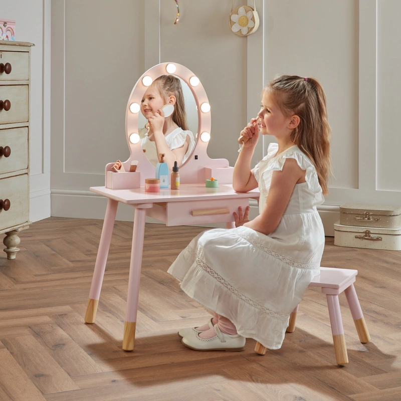 Child sitting at Dimples wooden vanity table UK