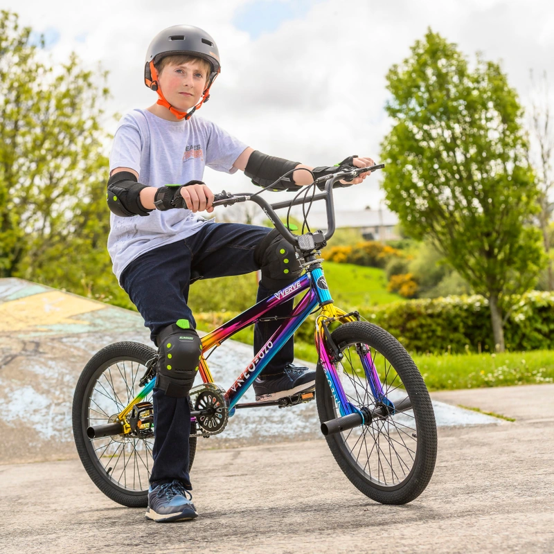 Kids riding 20 inch BMX bike in park