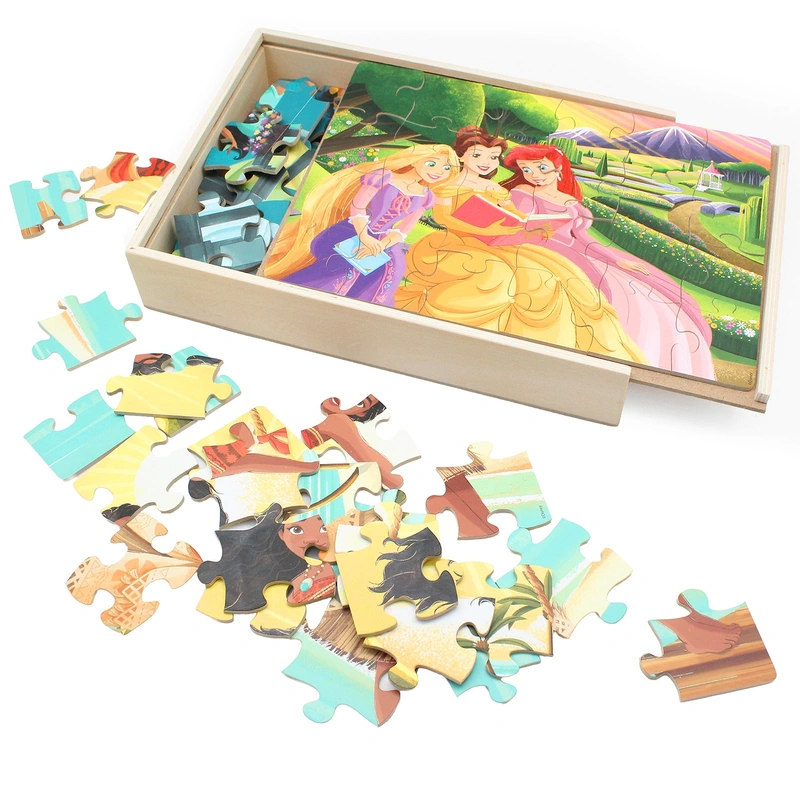 Child playing with wooden princess puzzles