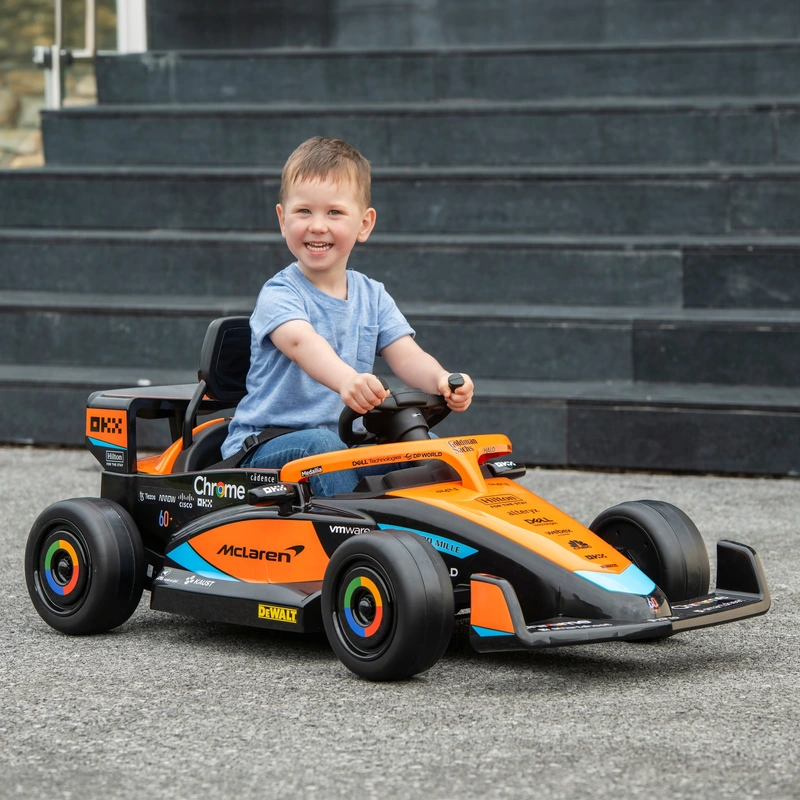 Young child driving McLaren F1 electric ride on