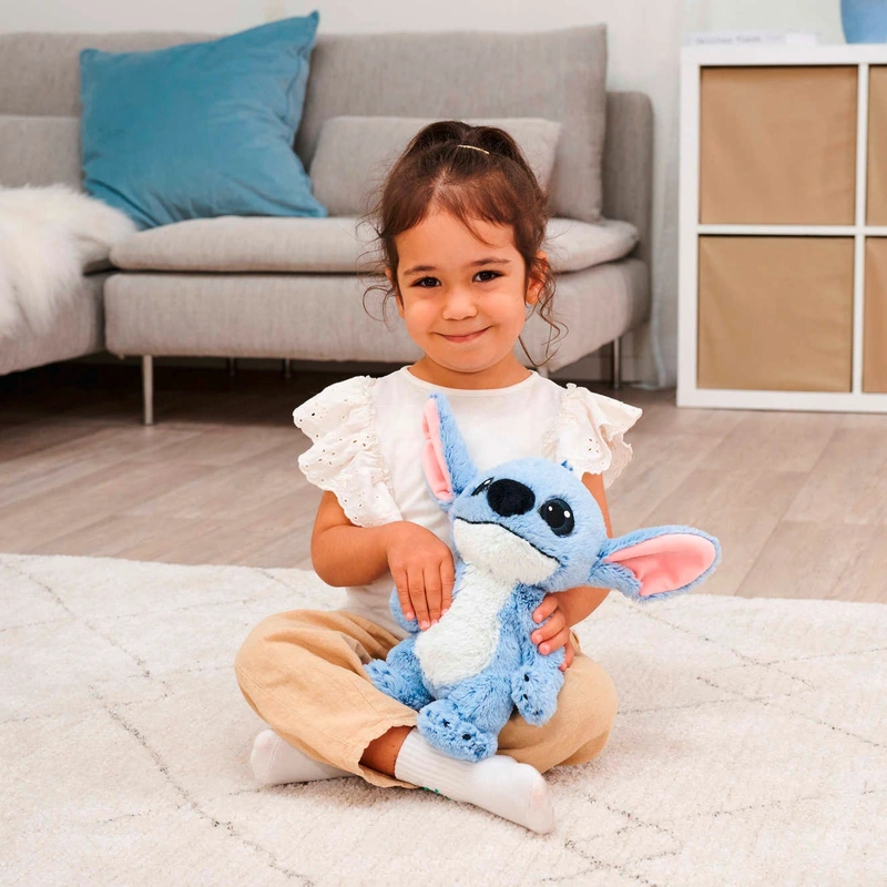 Disney Stitch Live Action 25cm Plush Toy sitting on bed UK
