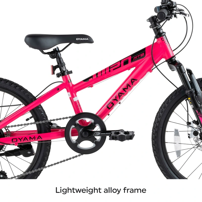 Child riding Oyama JM20 mountain bike on gravel path UK