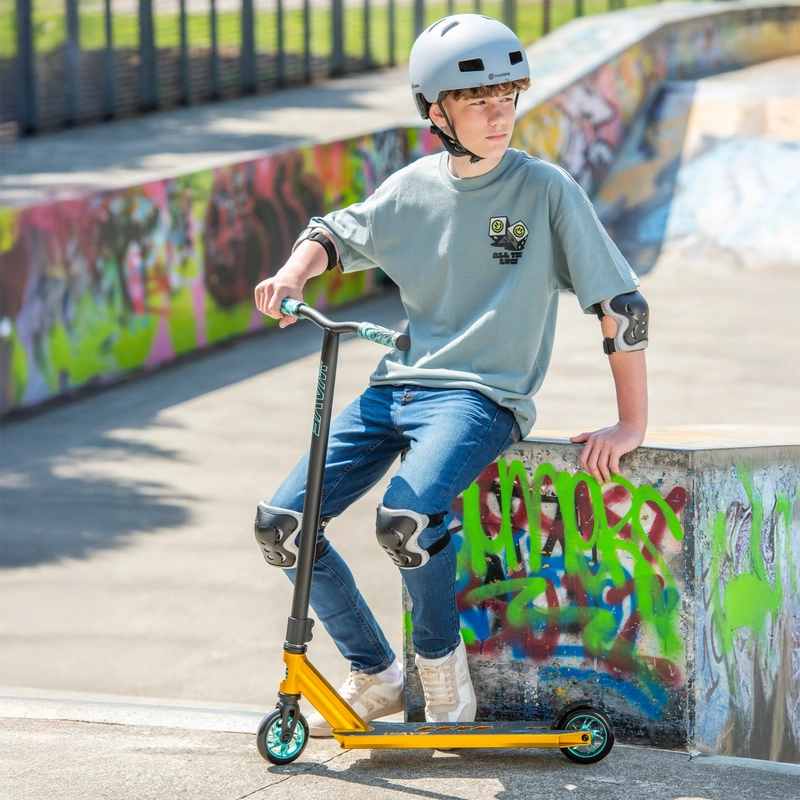 Rider using Blindside Wave Stunt Scooter at skatepark