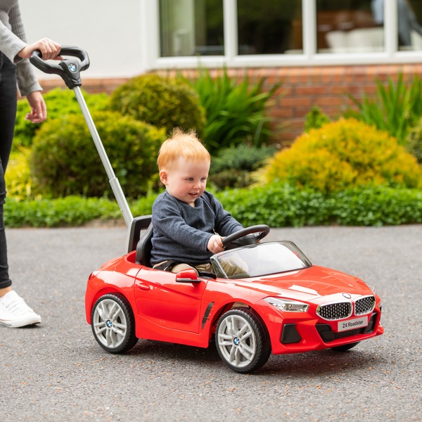 Parent push shop along car