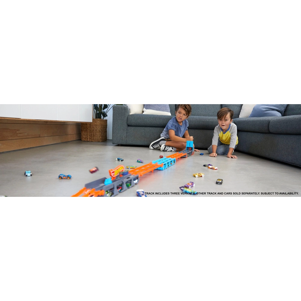 Super Transporteur Hot Wheels Extensible – Range Jusqu’à 20 Voitures – Se Transforme En Piste De 182 Cm – 3 Voitures Incluses – Dès 4 Ans